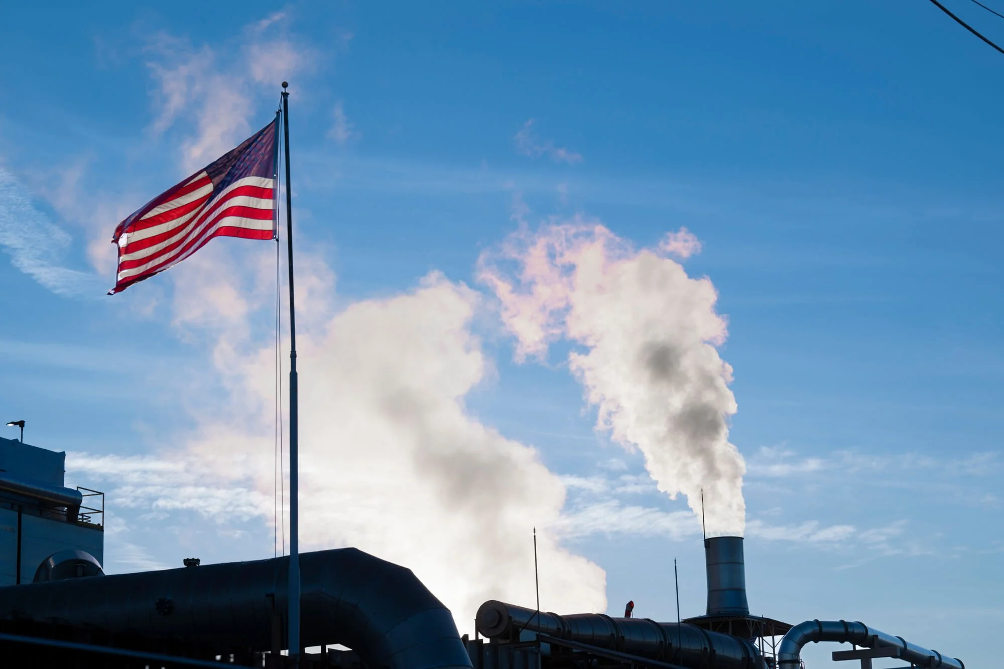 Refinery steam exhaust with flag in foreground shot for Ed Carreon Photography in Sand Diego