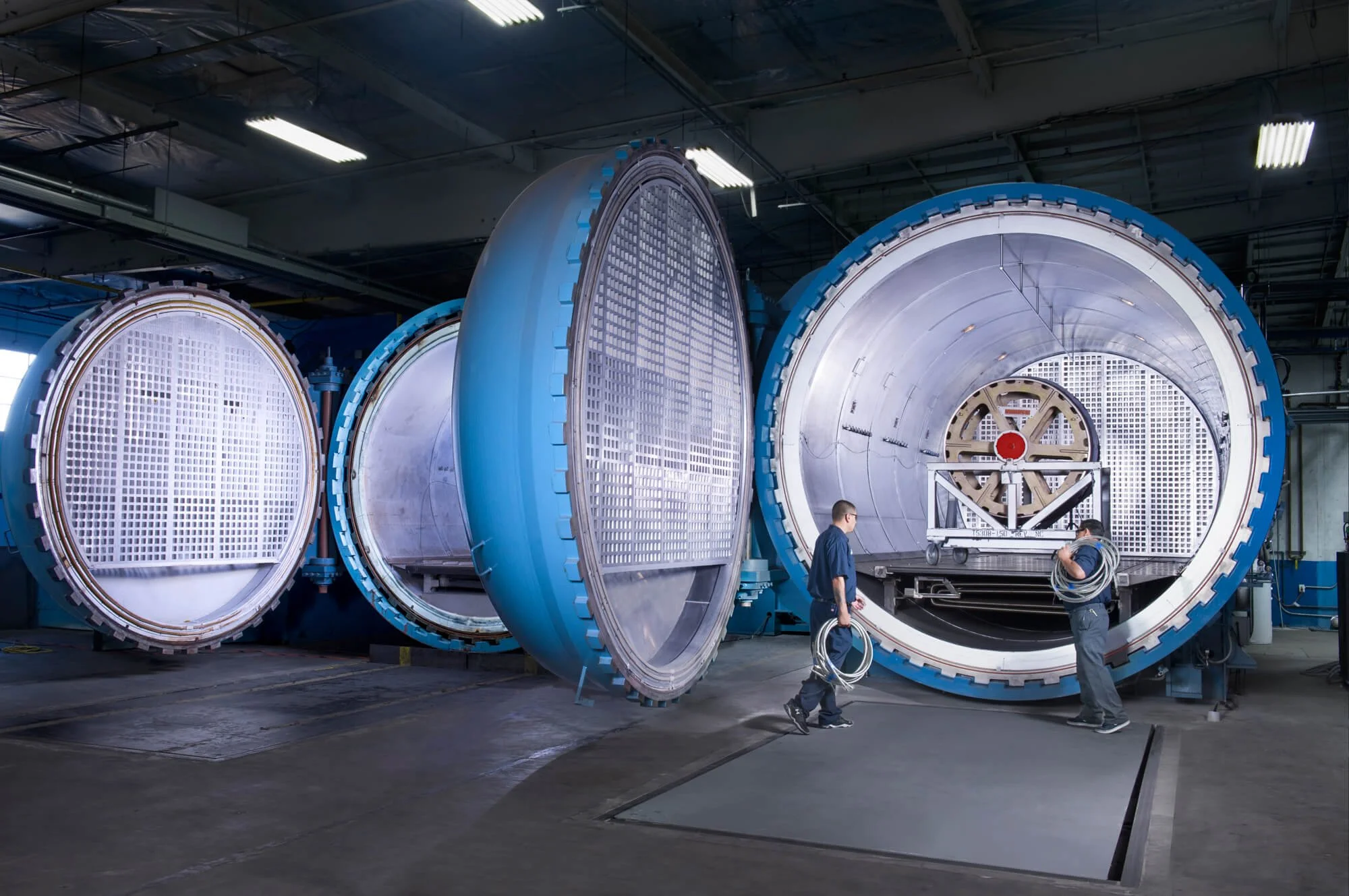 Workers loading an autoclave photographed for aerospacecompany Carbon Composites