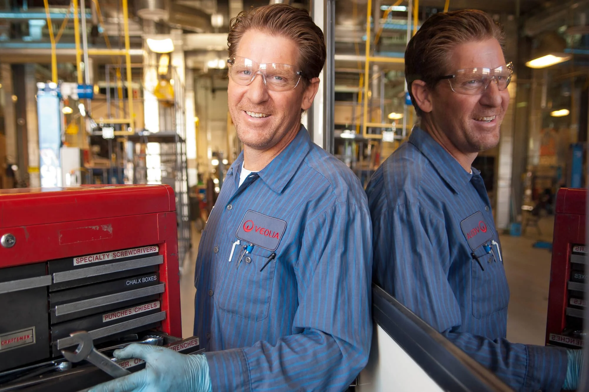 Portrait of a bus mechanic at Veolia Transportation bus yard.
