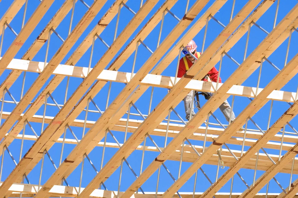 Construction worker framing roof 
