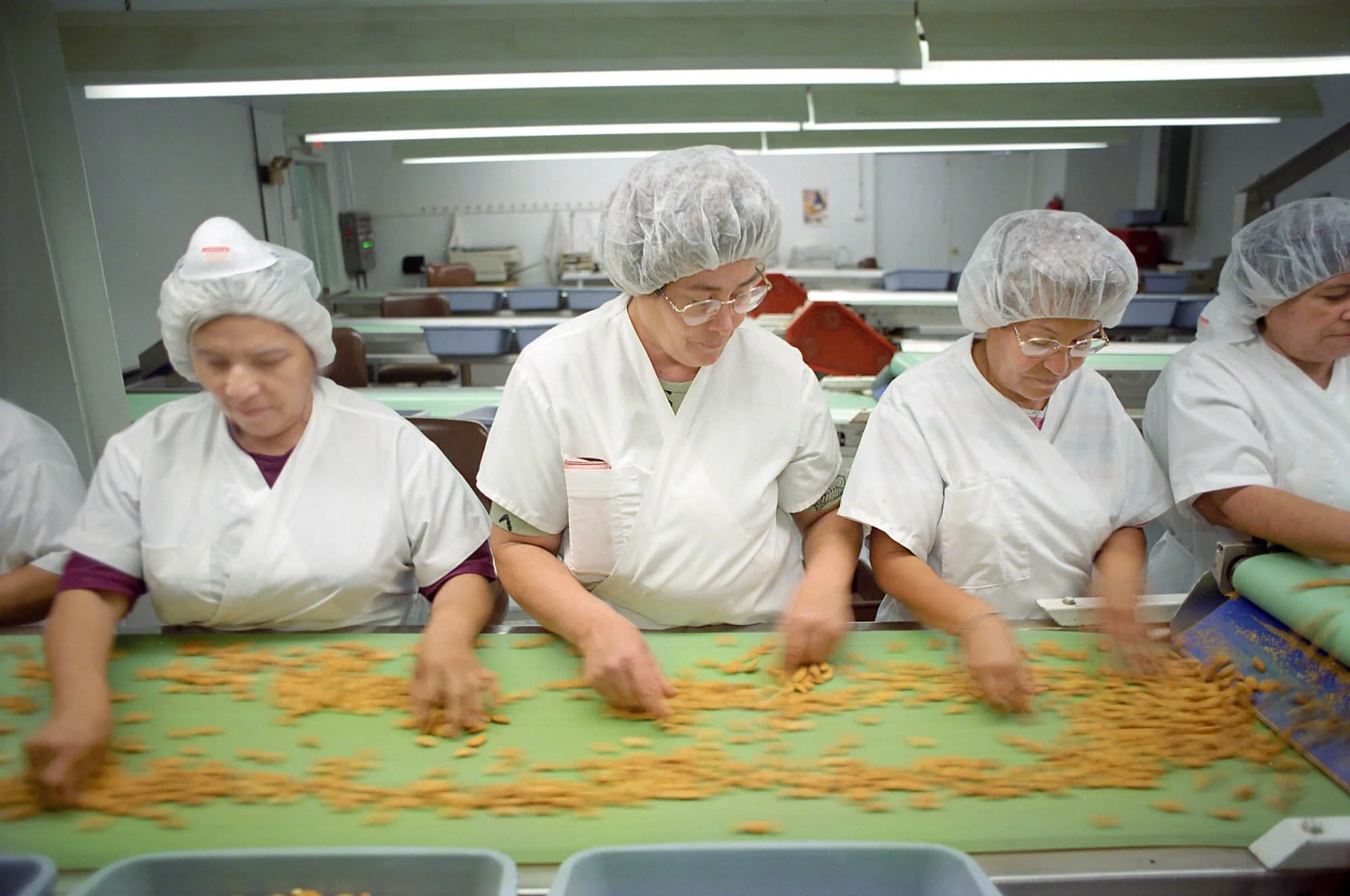 Women processing almonds in the Central Valley.