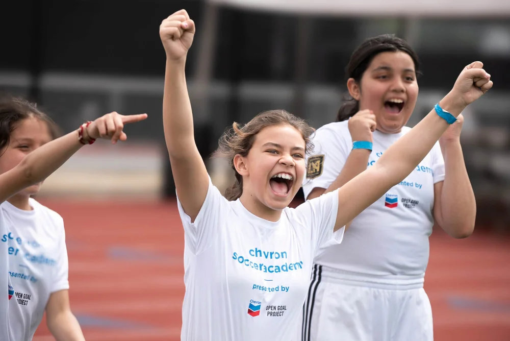  A victorious girl reacts to winning a soccer match at a Chevron-sponsored event. Event photography by Ed Carreon 