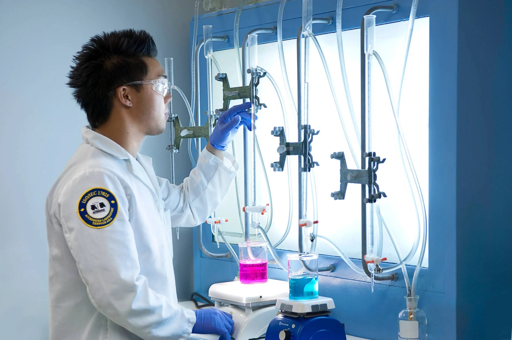 Food scientist testing liquids at Michaelson Laboratories in San Diego–Ed Carreon Photography