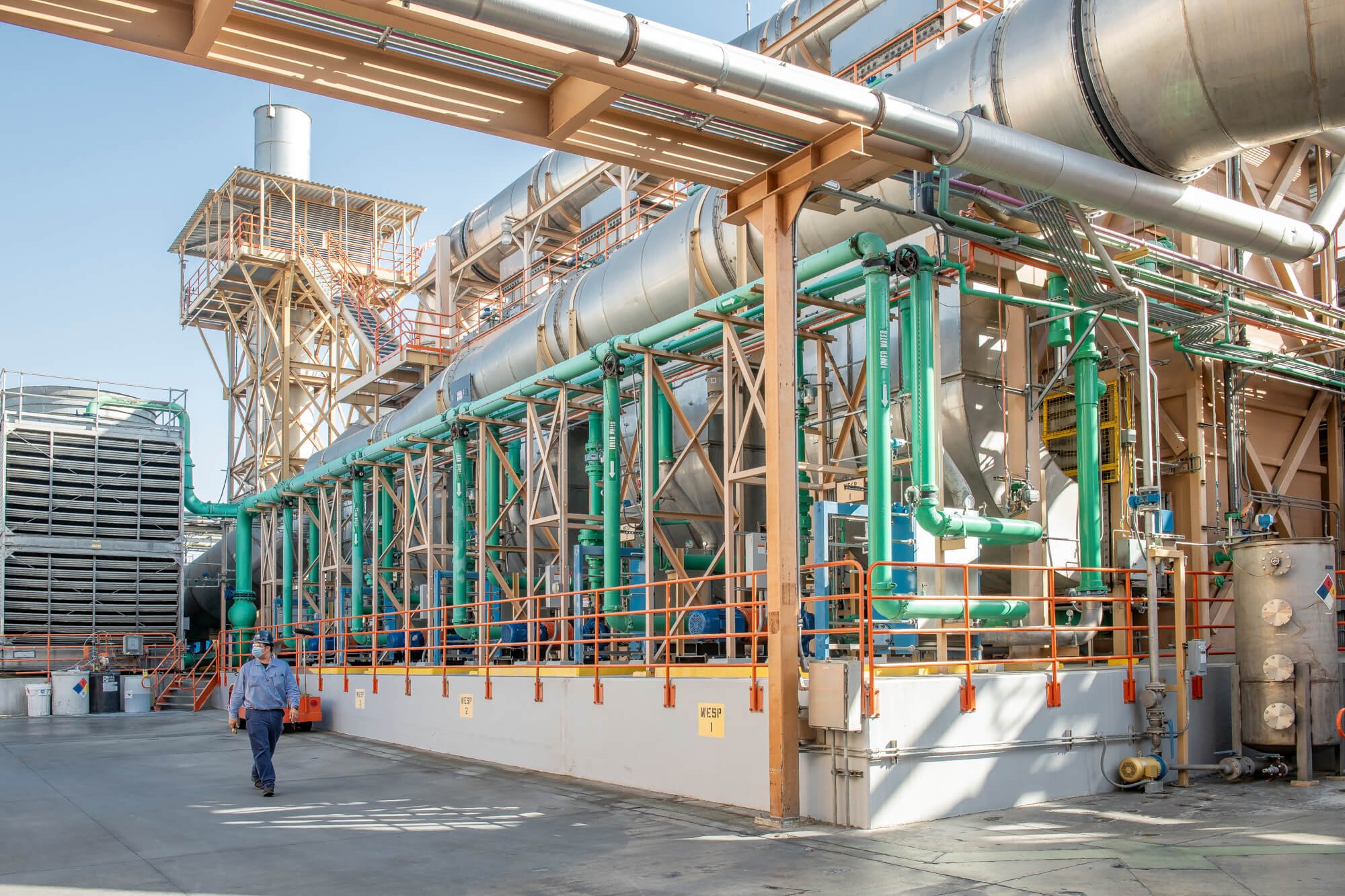 Technician walking through refinery facility in San Diego–Ed Carreon Photography