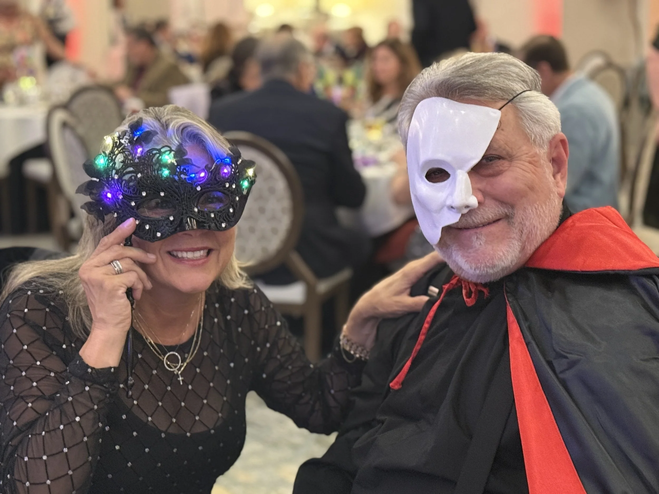 Mark and Kimberlee Aliapoulios in their masks