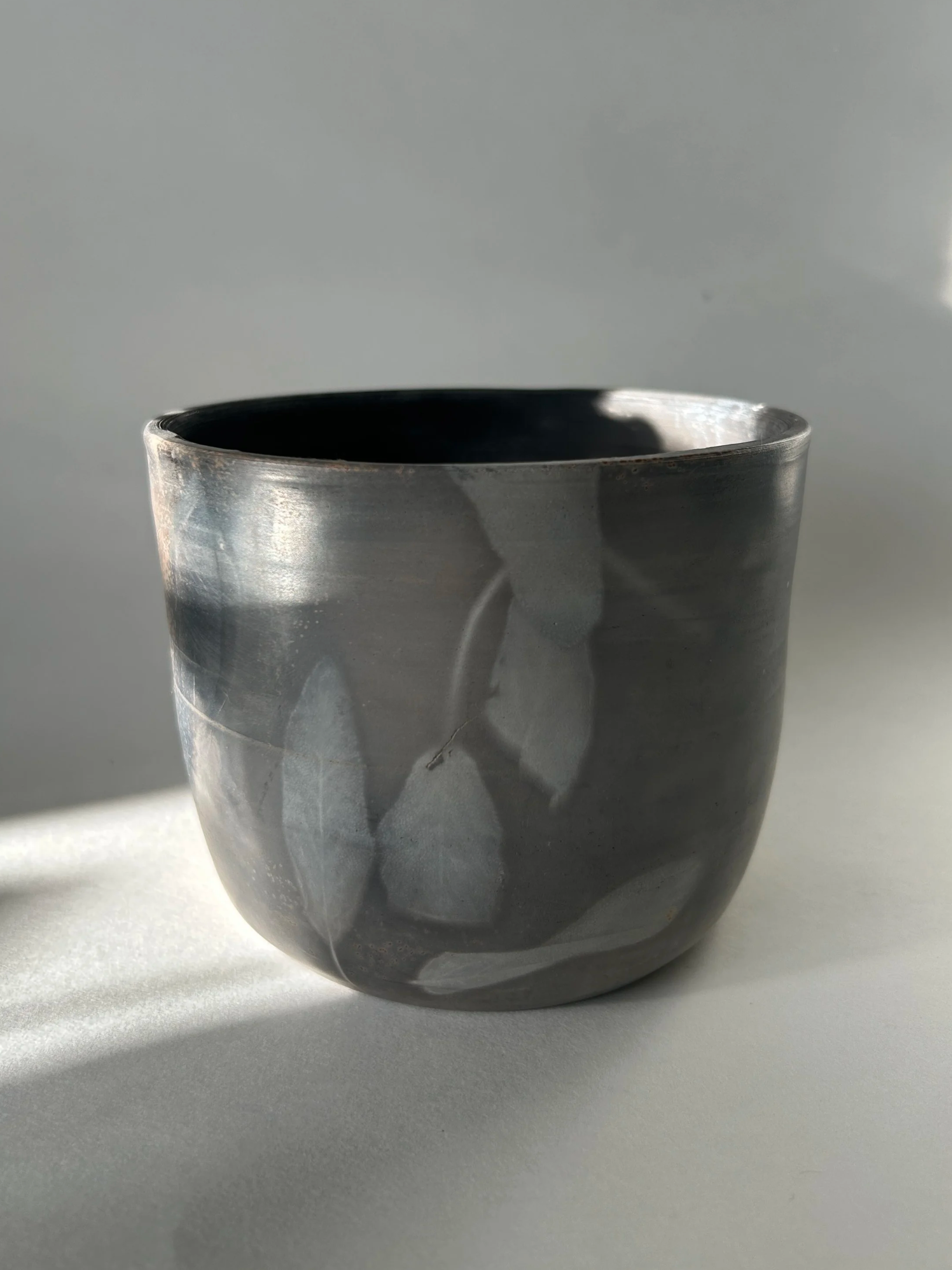 Pit fired pottery with sage leaves