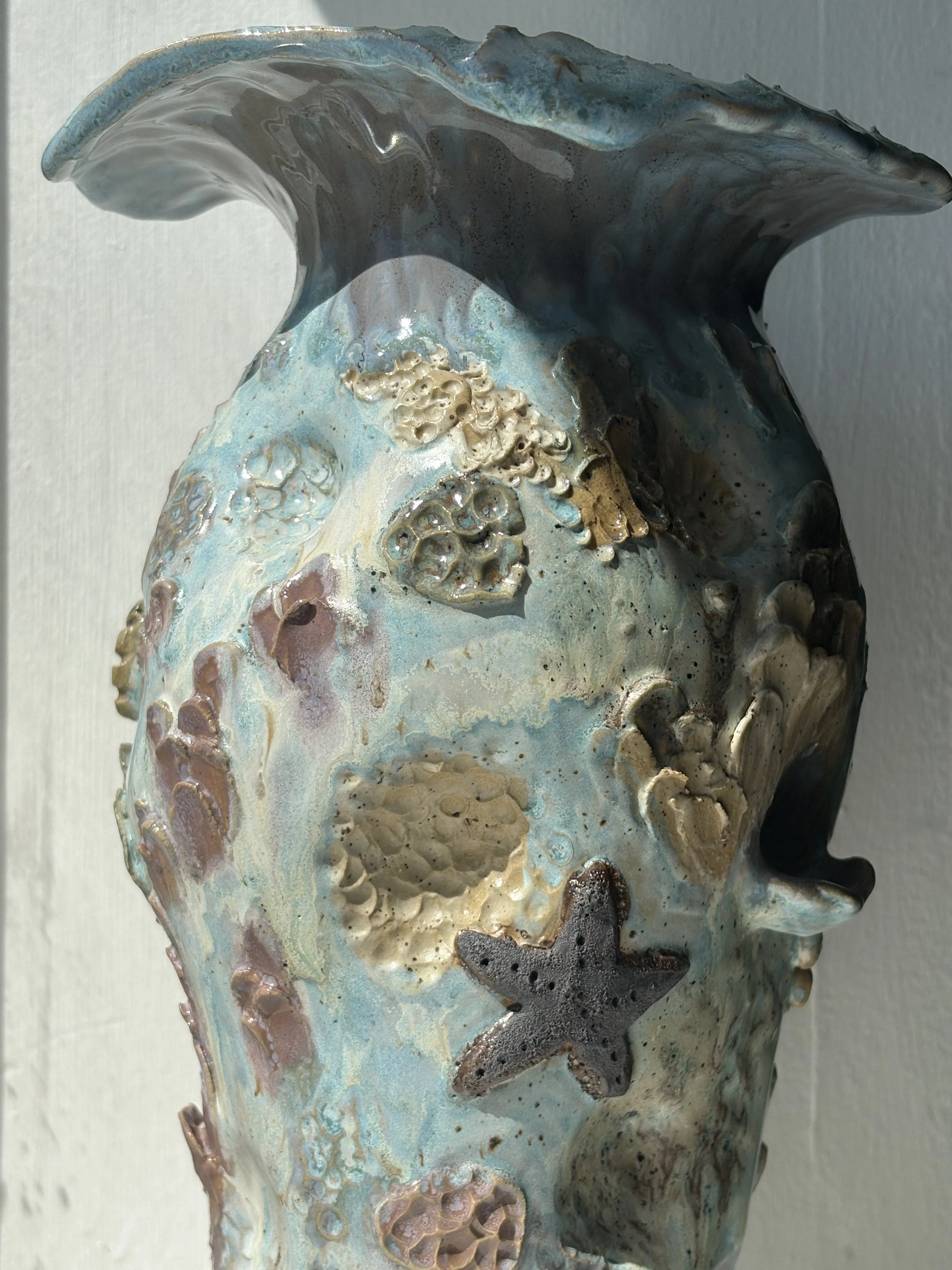 Stoneware vase with lots of texture inspired by the ocean