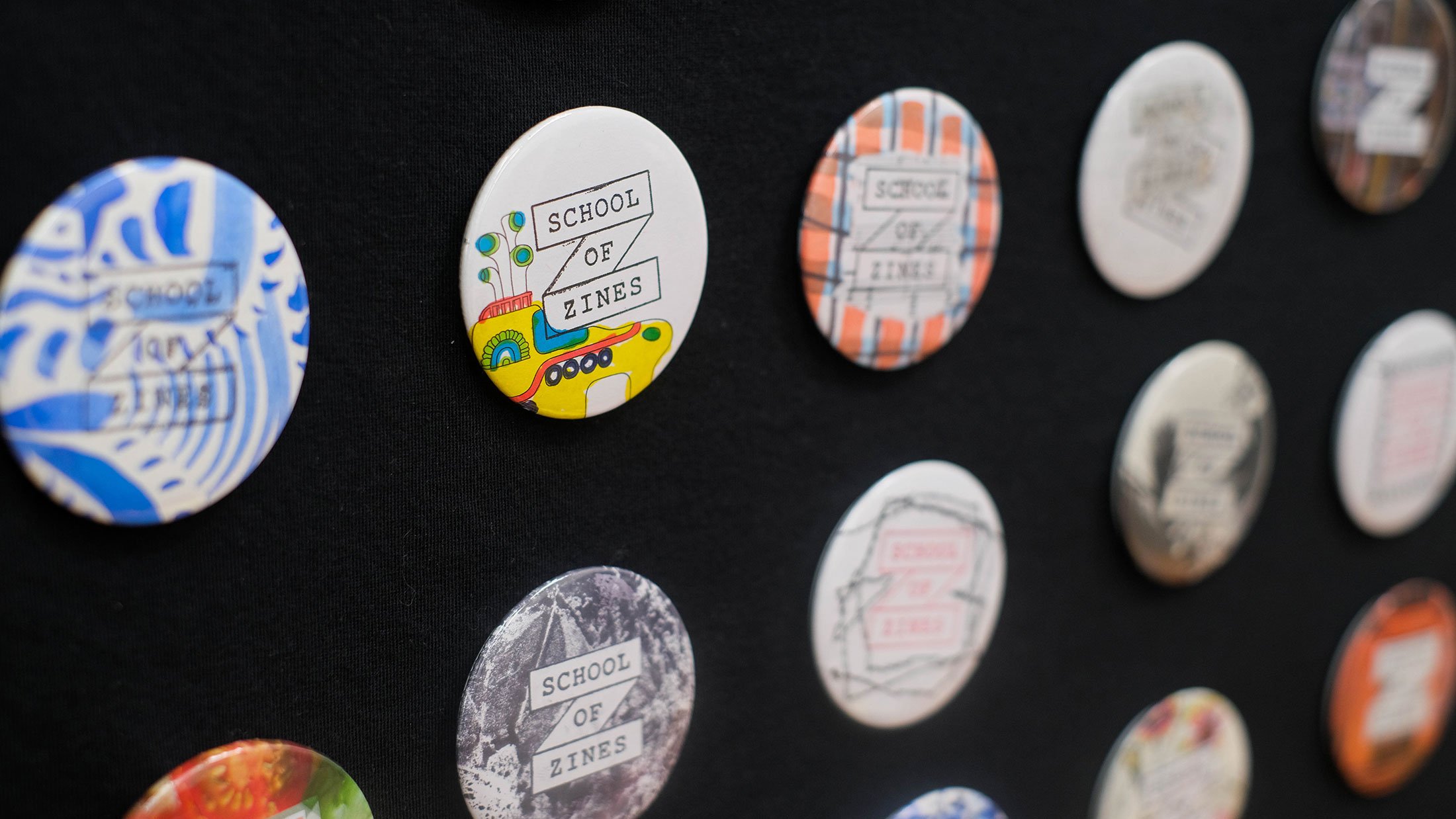 School of Zines badge display.