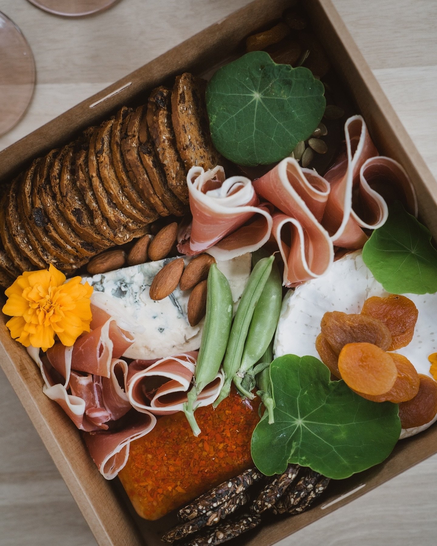 The best way to enjoy your stay with this weather is a bottle of wine, a delicious grazing box (as pictured from @graze.and.dine.co) and a warm fire!