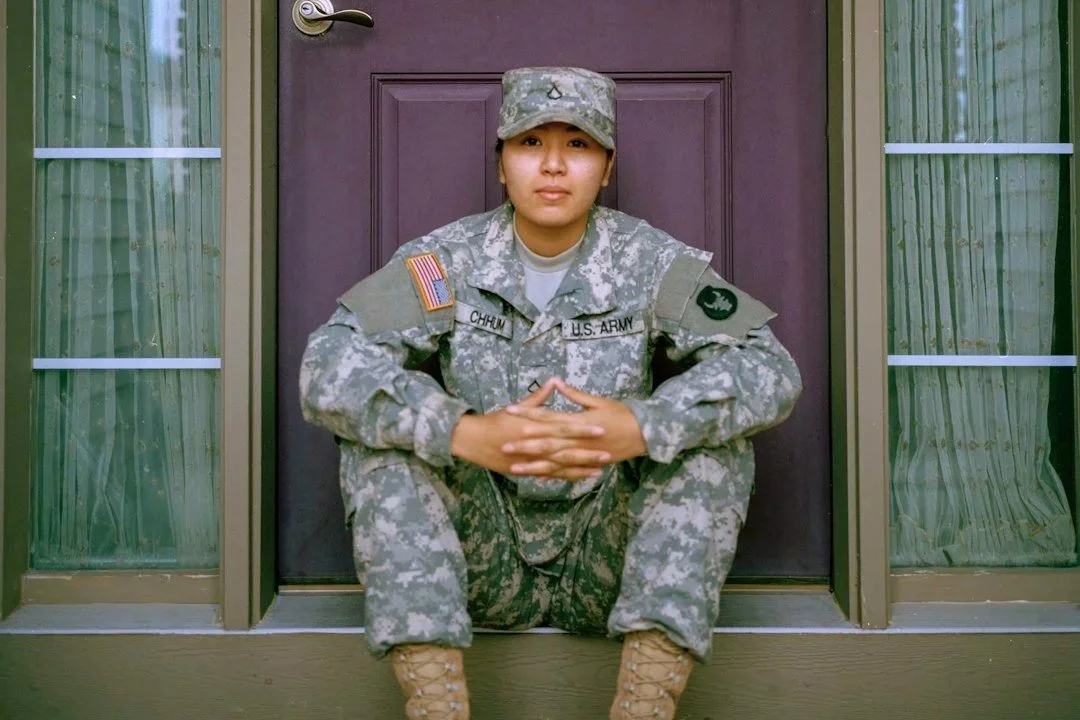 U.S. Army soldier sitting on a doorstep