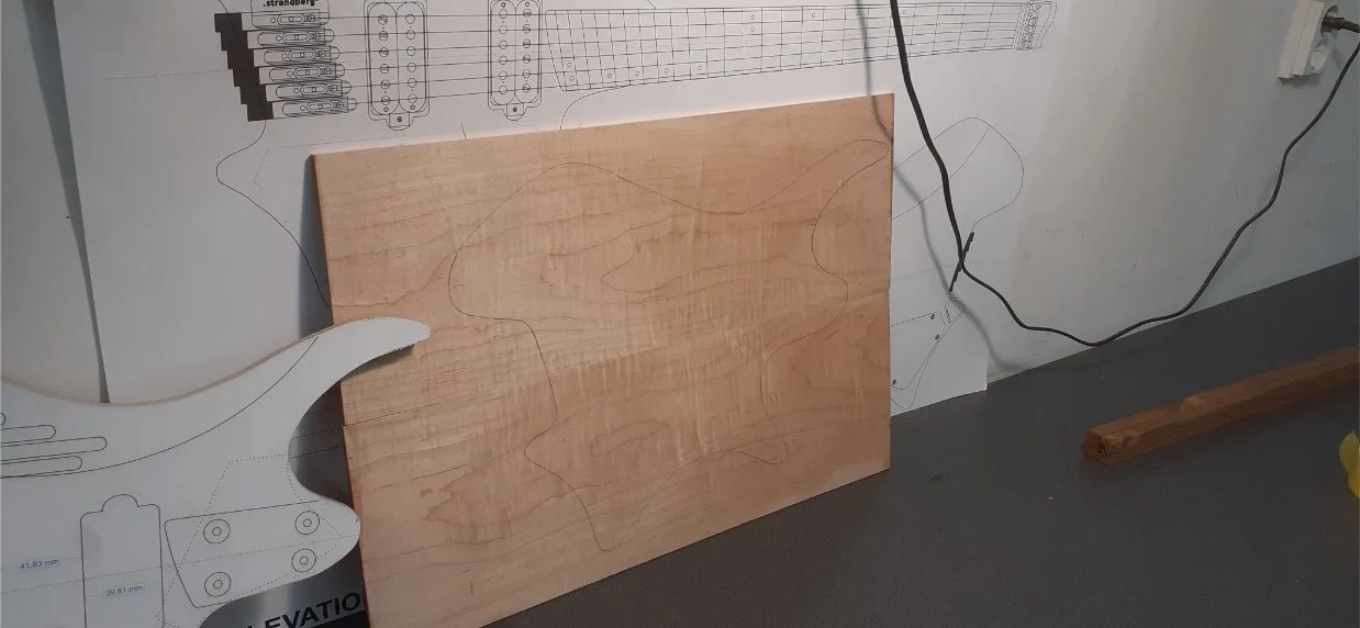 The jointed board. This actually worked very well. The joint was almost perfectly aligned, and didn't need much planing flat, and it is invisible on the finished instrument.