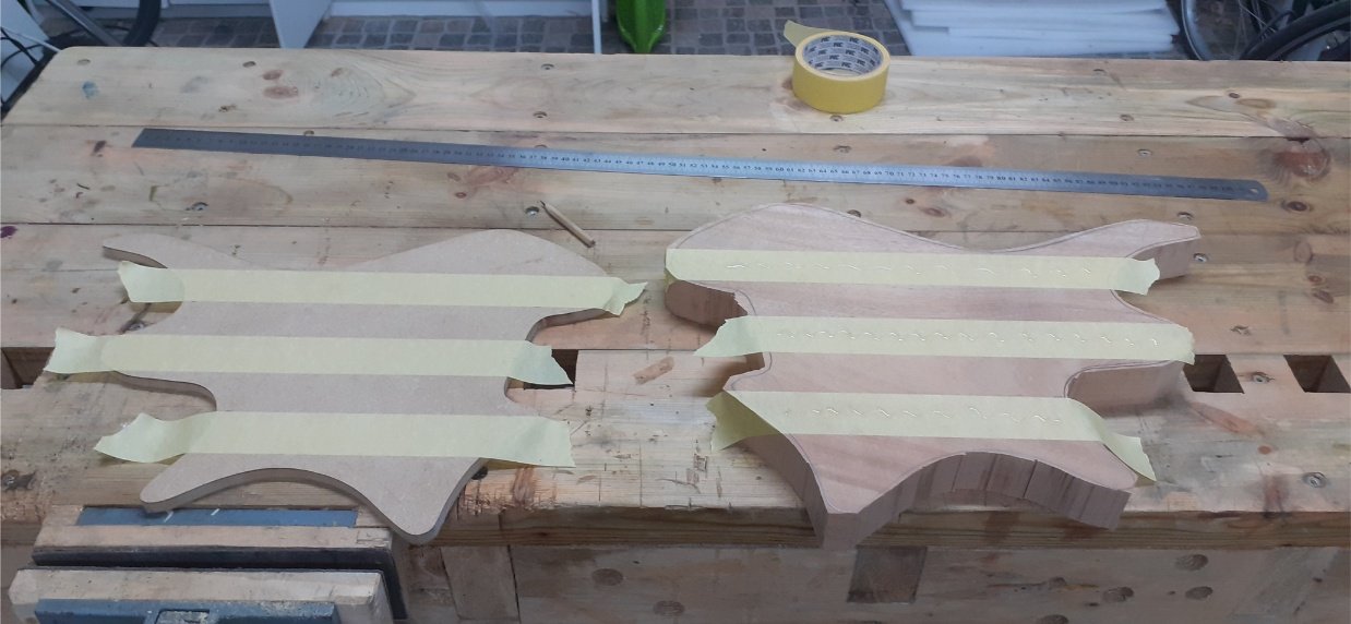 Sticking the template to the body using the masking tape and superglue trick.