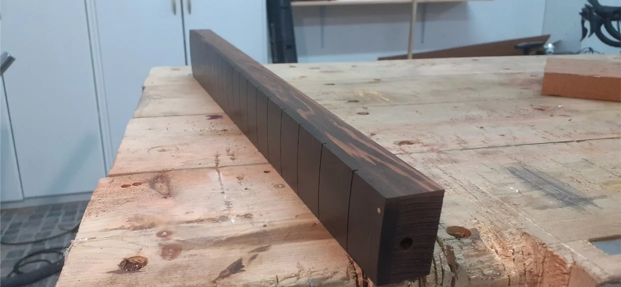 Using the fingerboard as a template, I used the router with a flush-cut bit to get it down to width.