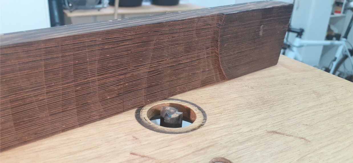 Taking a few milimeters off the thickness of the neck, but leaving the heel at full thickness.
