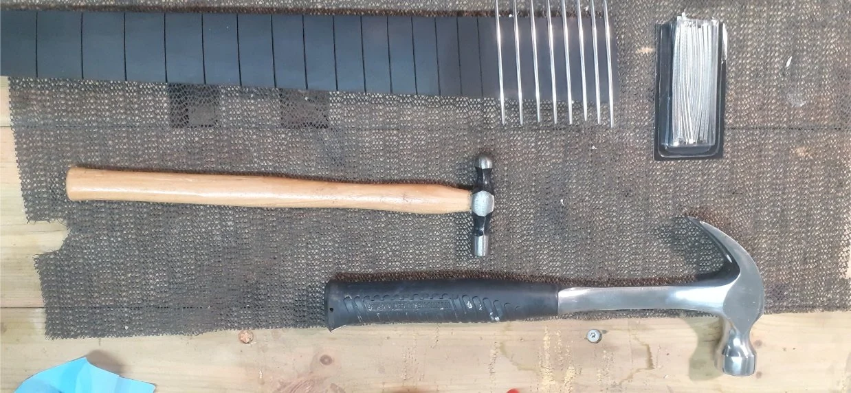 Installing the frets. This did not go well, but turned out good in the end, after lots of work. Next time, I will press the frets in with some sort of clamp, rather than hammering them in.