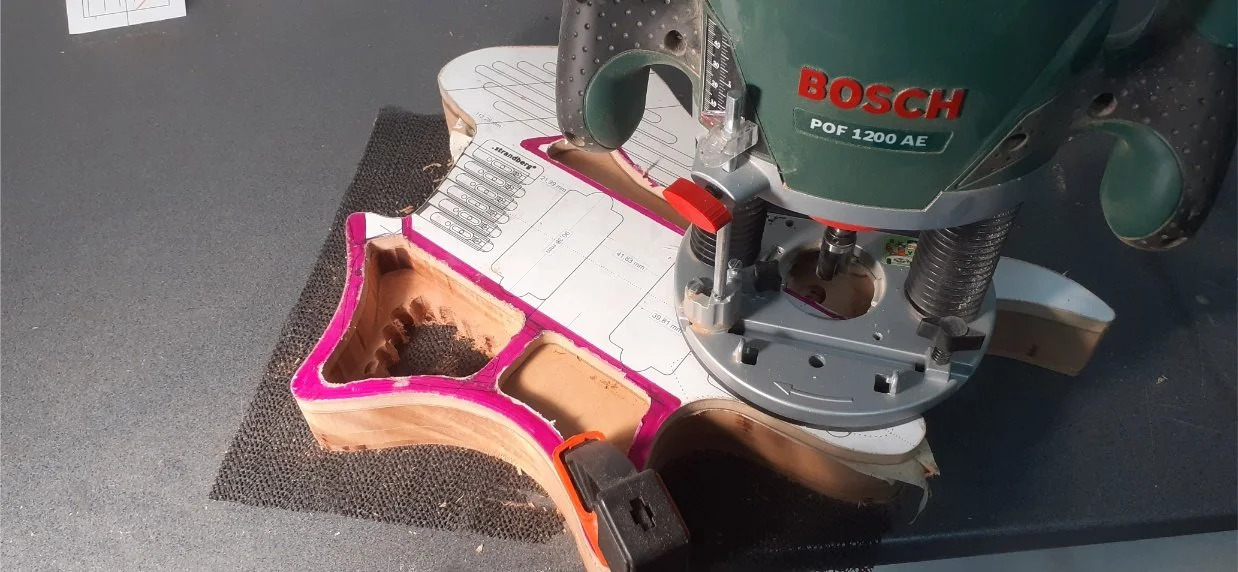 Routing the shape of the cavities and chambers. I wanted to remove as much wood from inside the body as possible to reduce weight and give myself room for the wiring.