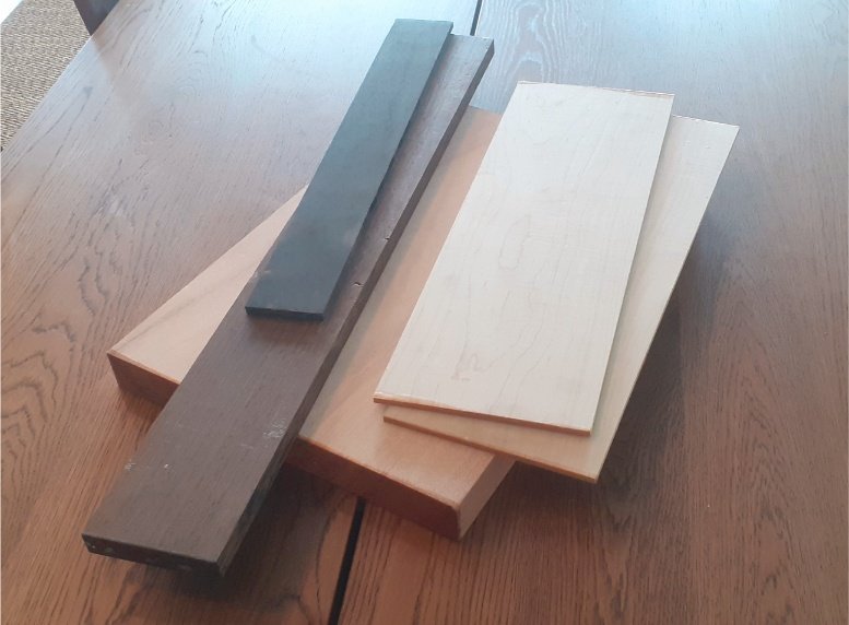 Where it all started. A lump of mahogany, a length of wenge, a strip of ebony, and two boards of maple.
