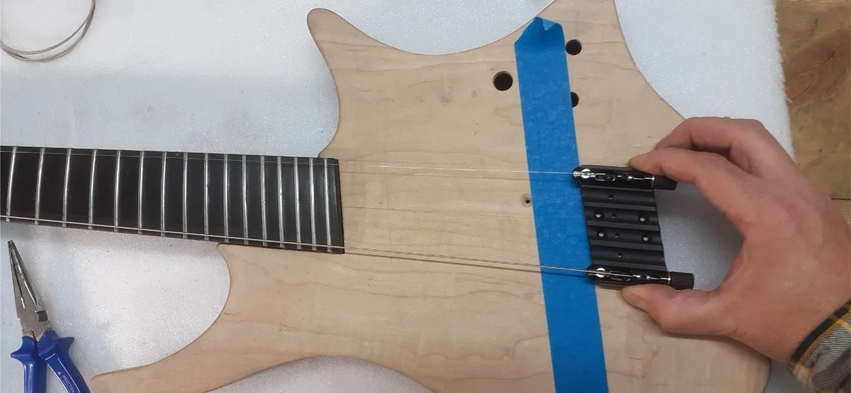 With the neck position finalised, I could finalise the position of the bridge. The bridge is a special angled one from Mera Guitars, with the perfect angle for my chosen scale lengths. (Cllick the image to link to Mera.)