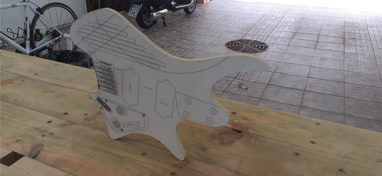 I found a design for a Strandberg guitar, printed it, stuck on to MDF, and cut out. This was used a routing template for the outline, and subsequently the cavities. I didn't use the neck pocket, pickups, or bridge position on the design, as they were