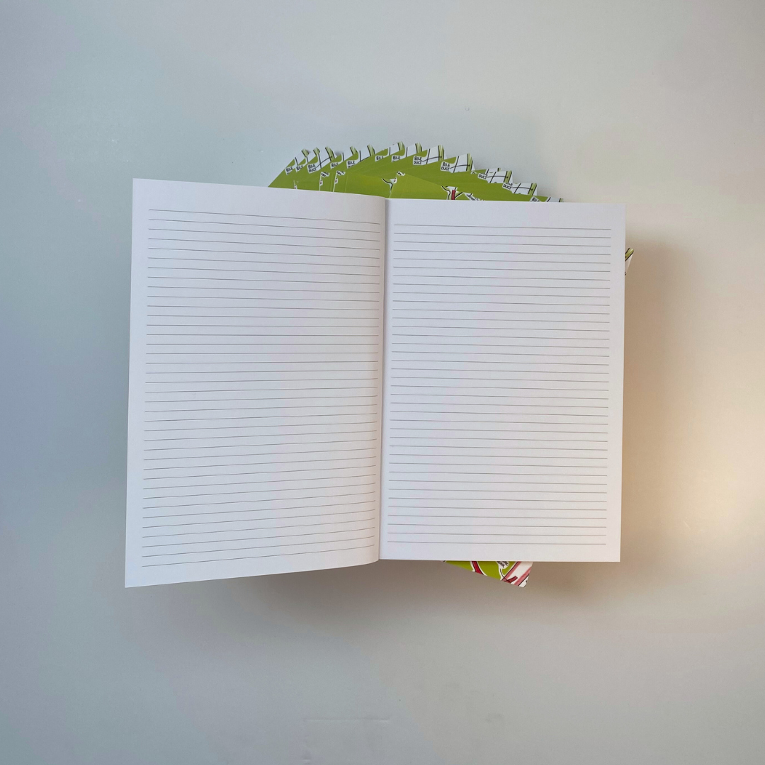 a green gallbladder anatomy-notebook open, showing the inside A5-lined paper.