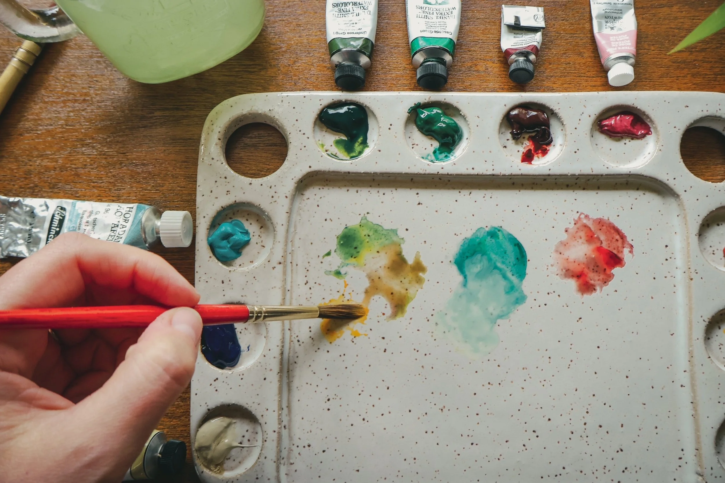 mixing watercolor paints on palette.JPG