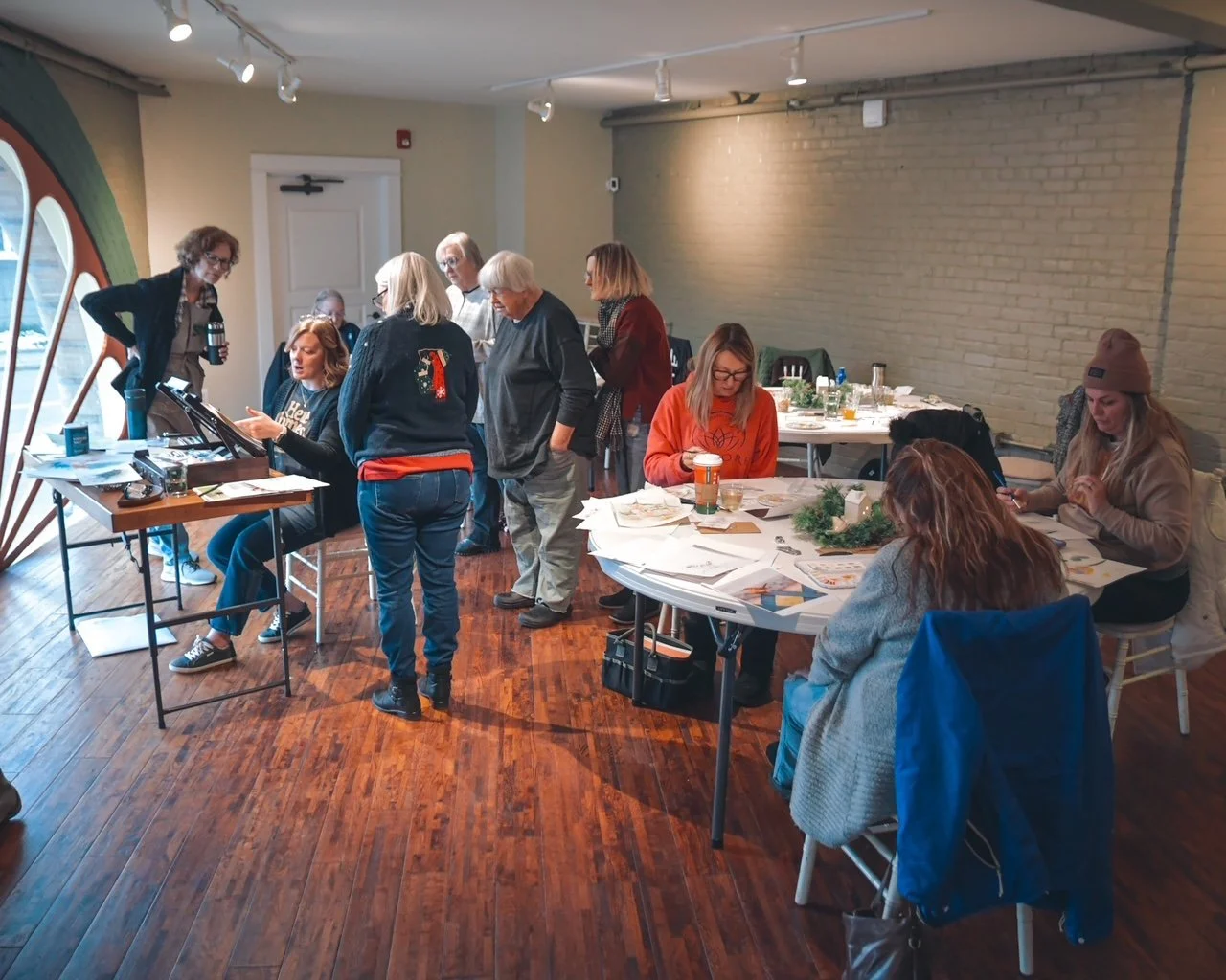 students oberserving watercolor artist paint.JPG