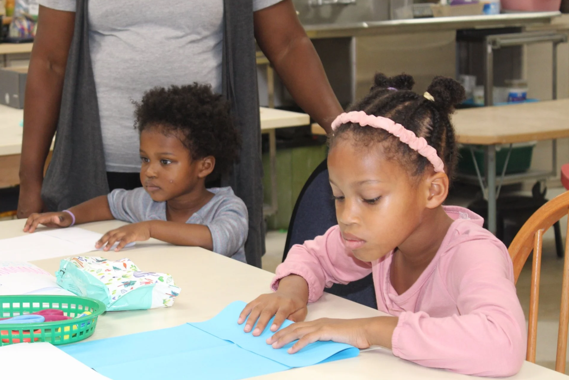 Two young girls making arts and crafts at Fairmount's open studio