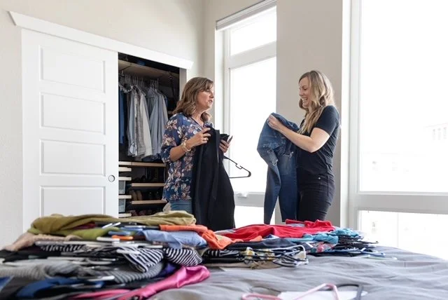 A stylist discussing  clothing choices with a client