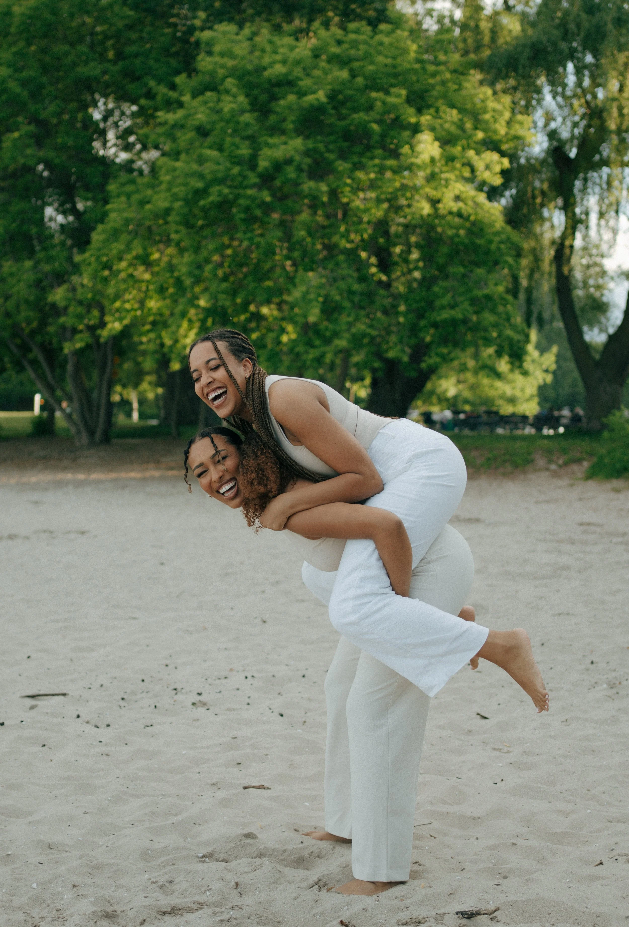 Two friends laughing during lifestyle photography session, Barrie Ontario