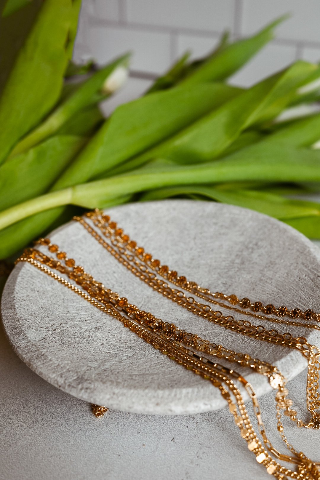 Gold permanent jewelry chains and necklace options by MIKU Jewelry in Frederick, MD