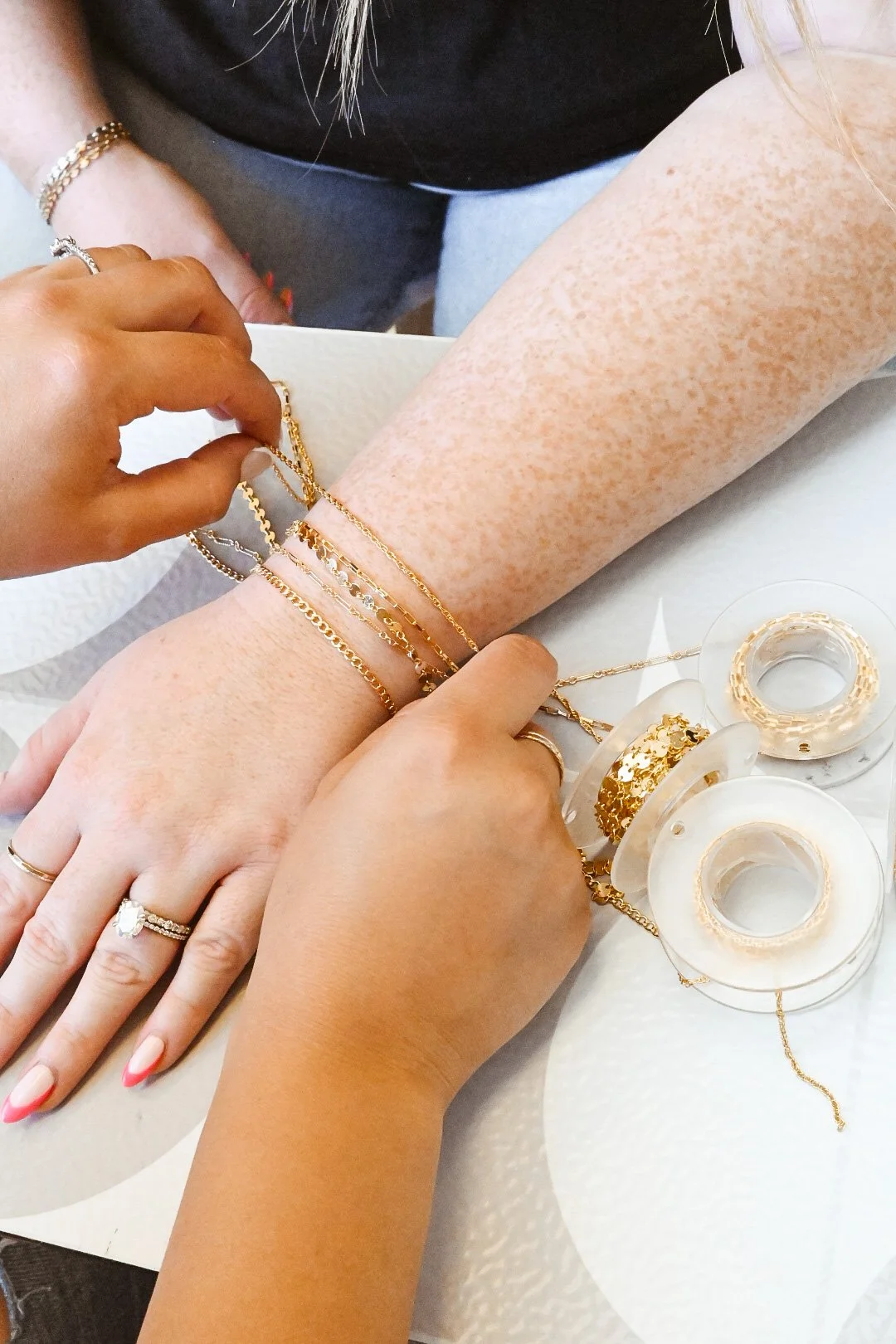 MIKU Jewelry fitting custom gold permanent bracelets in Frederick, MD