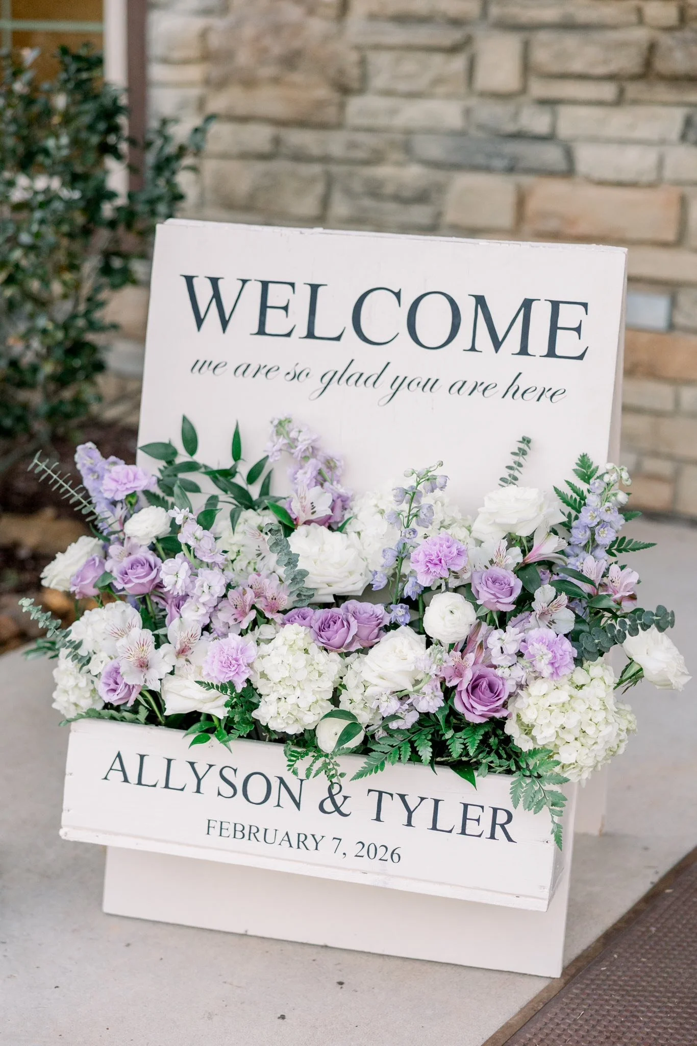 Lavender florals in A-frame welcome sign.