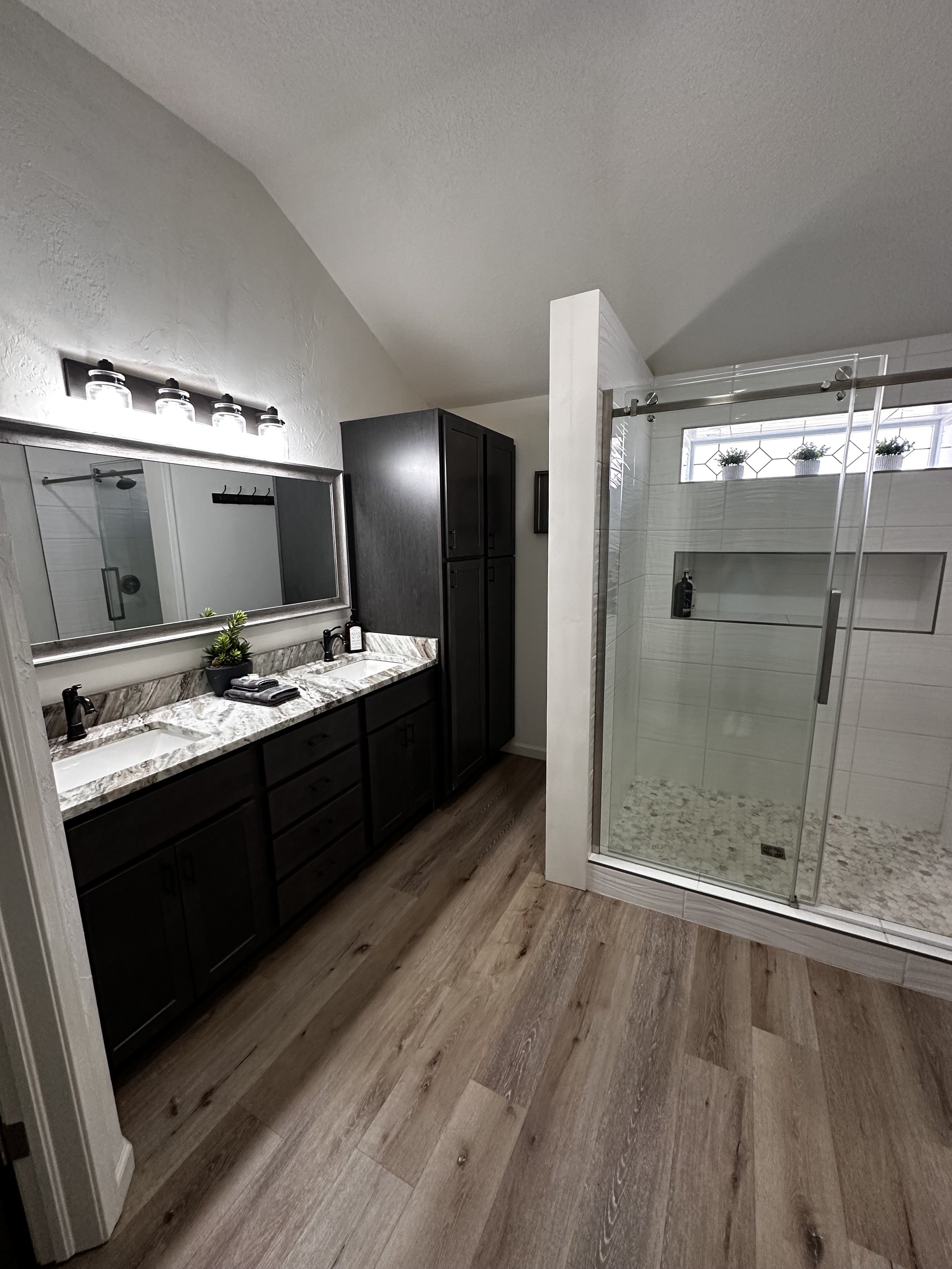 Bathrooms: floors, showers/tubs, toilets, sinks, countertops, mirrors