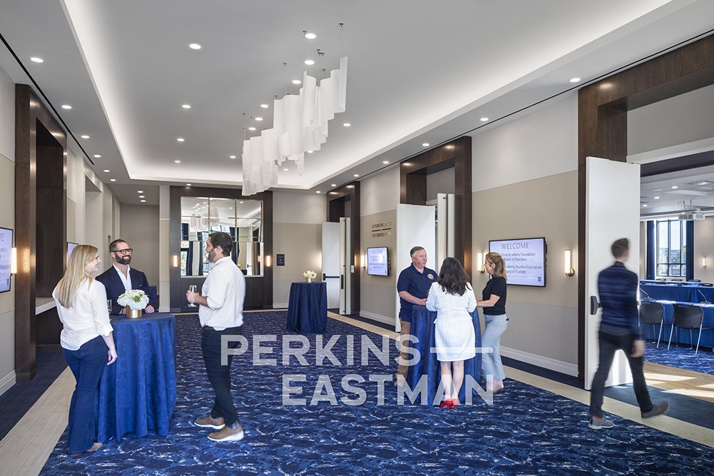 USNA - Fluegel Alumni Center_Photo Int Pre-Function w People_Photograph by Andrew Rugge - Copyright Perkins Eastman.jpg