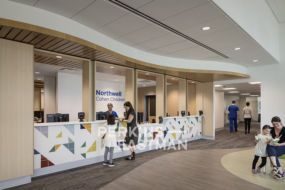 Northwell Health - Pediatric Ortho & Urology_Photo Int Arrival Reception Desk w People_Photograph by Andrew Rugge - Copyright Perkins Eastman.jpg