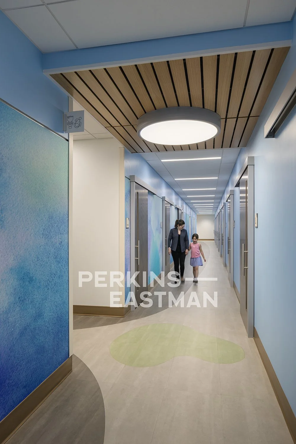 Northwell Health - Pediatric Ortho & Urology_Photo Int Patient Corridor South w People_Photograph by Andrew Rugge - Copyright Perkins Eastman.jpg