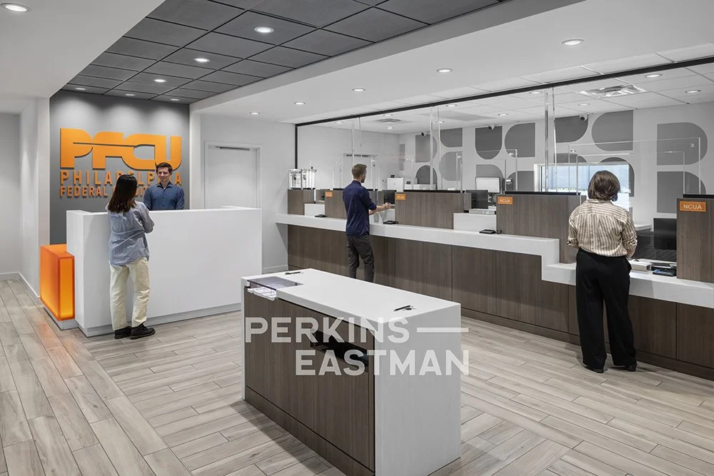 PFCU - Glenside_Photo Int Teller Desk w People_Photograph by Sean Gold - Copyright Perkins Eastman.jpg