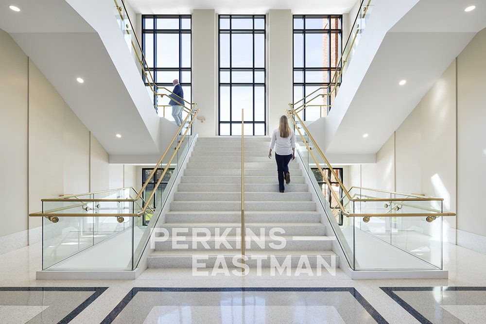 USNA - Fluegel Alumni Center_Photo Int Staircase 1 w People_Photograph by Andrew Rugge - Copyright Perkins Eastman.jpg