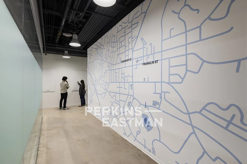 BioLabs Fit Up_Photo Int Graphic Wall w People_Photograph by Andrew Rugge - Copyright Perkins Eastman.jpg