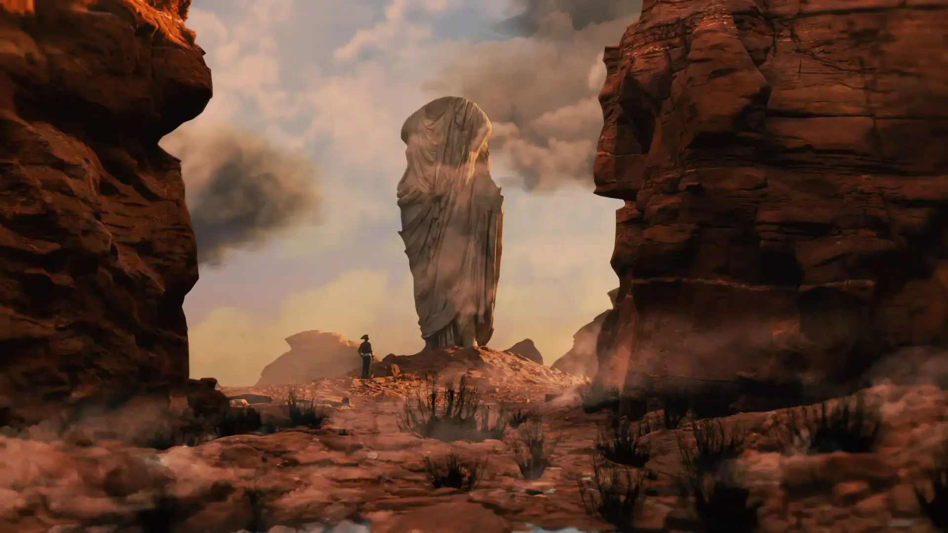 Ein Fotograf steht in einer Wüstenlandschaft mit roten Felsen und einer riesigen stehenden Felsenskulptur im Hintergrund, umgeben von Staub und Wolken.