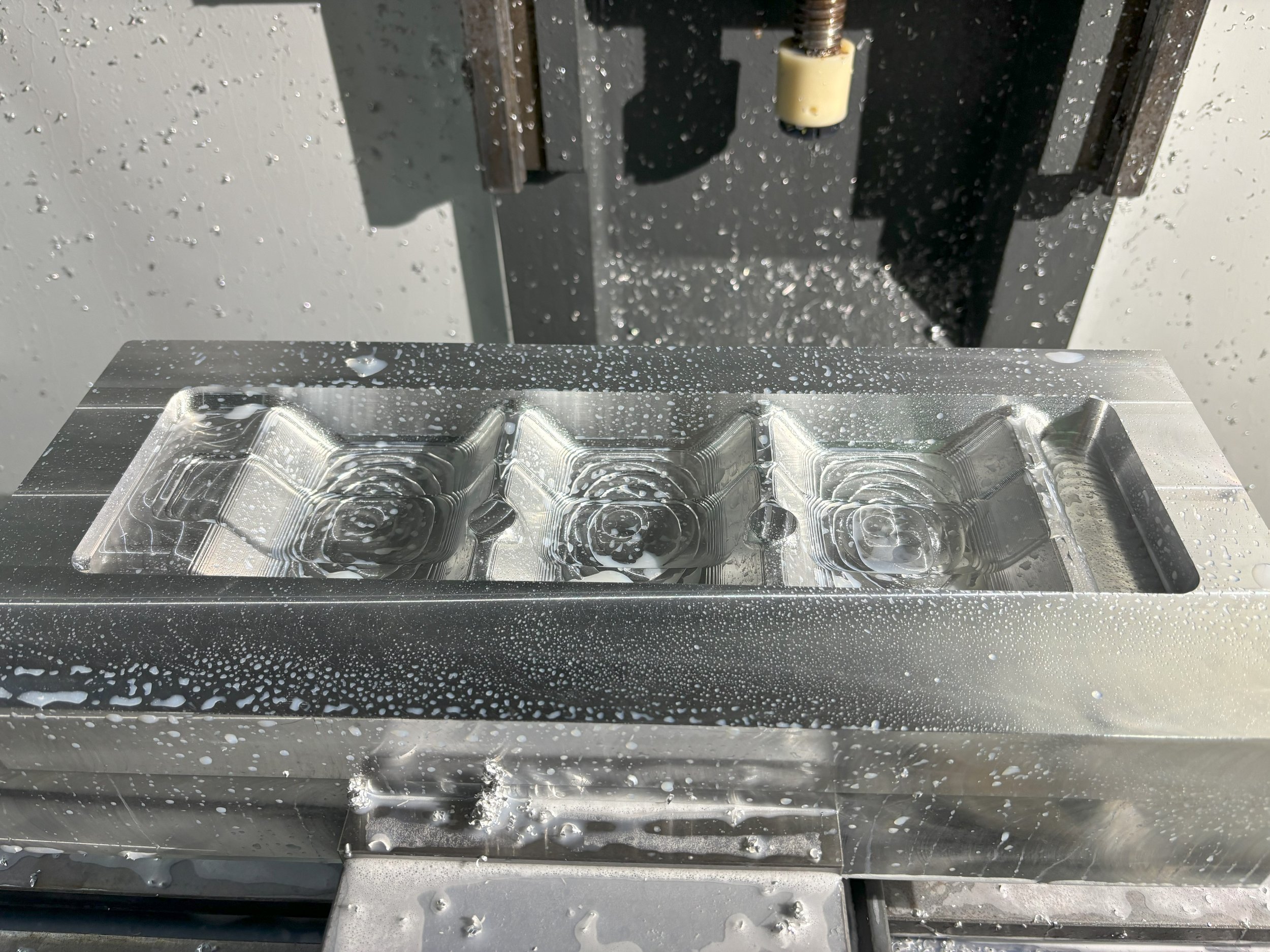 The mold after it was machined. This was completed in three operations due to the complexity of the vacuum and air ejection ports.