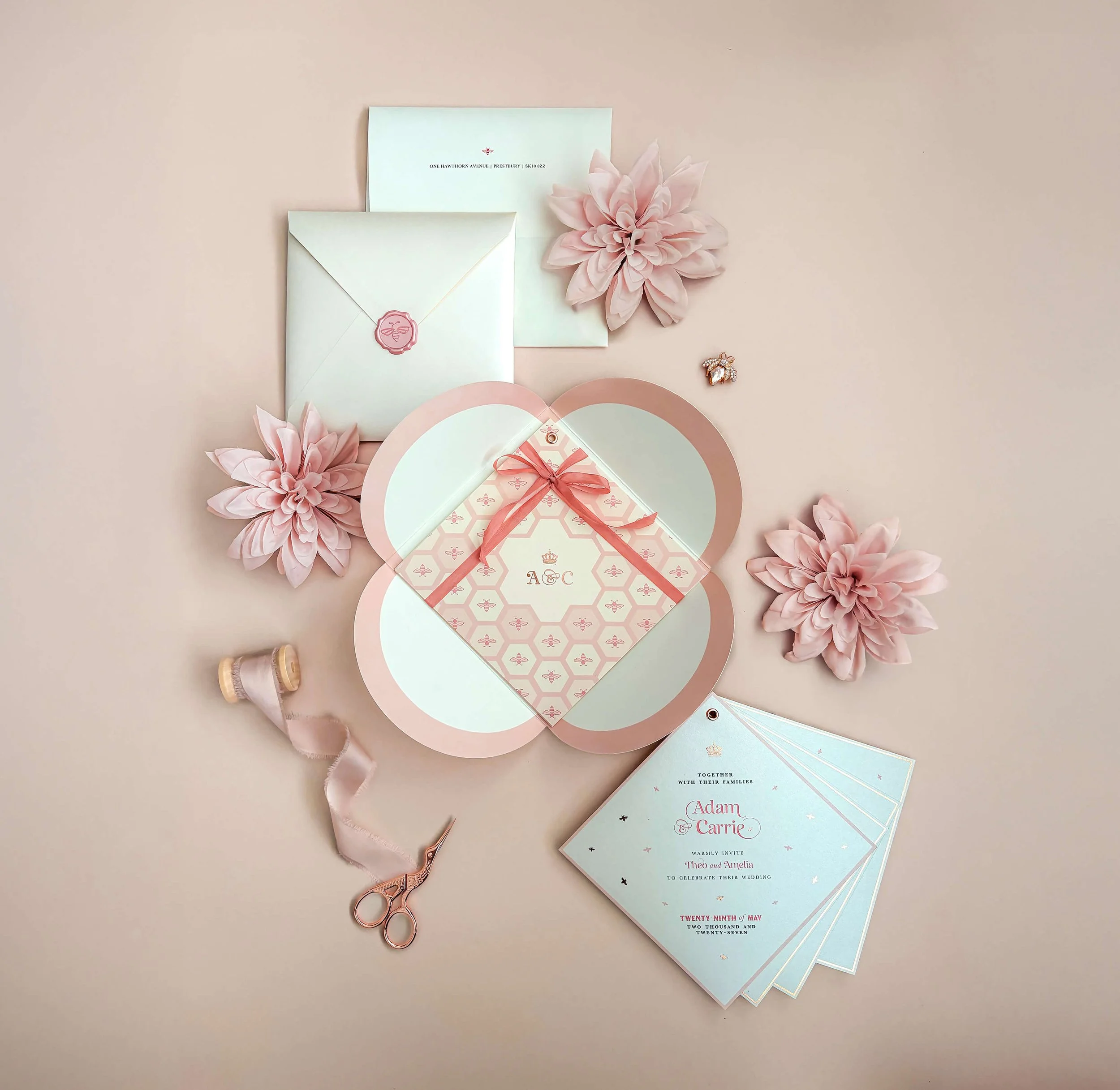 Luxury blush, ivory and rose wedding invitation suite with petal wallet, bee motifs, custom monogram, silk ribbon tie, envelope liner and wax seal. From the Sweet Like Honey wedding stationery collection by Honey Bee Mine.