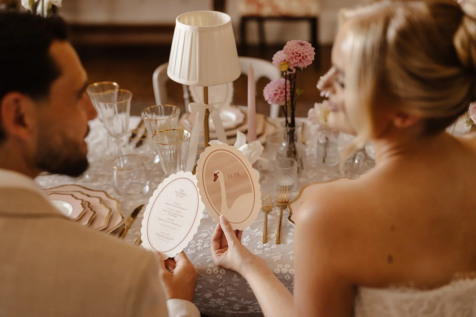 Luxury double-side wedding menus and place cards, featuring hand illustrated swan, soft blush tones, die-cut scalloped edges, and personalised with guest names. Designed by Carrie at Honey Bee Mine, and captured at Capesthorne Hall.