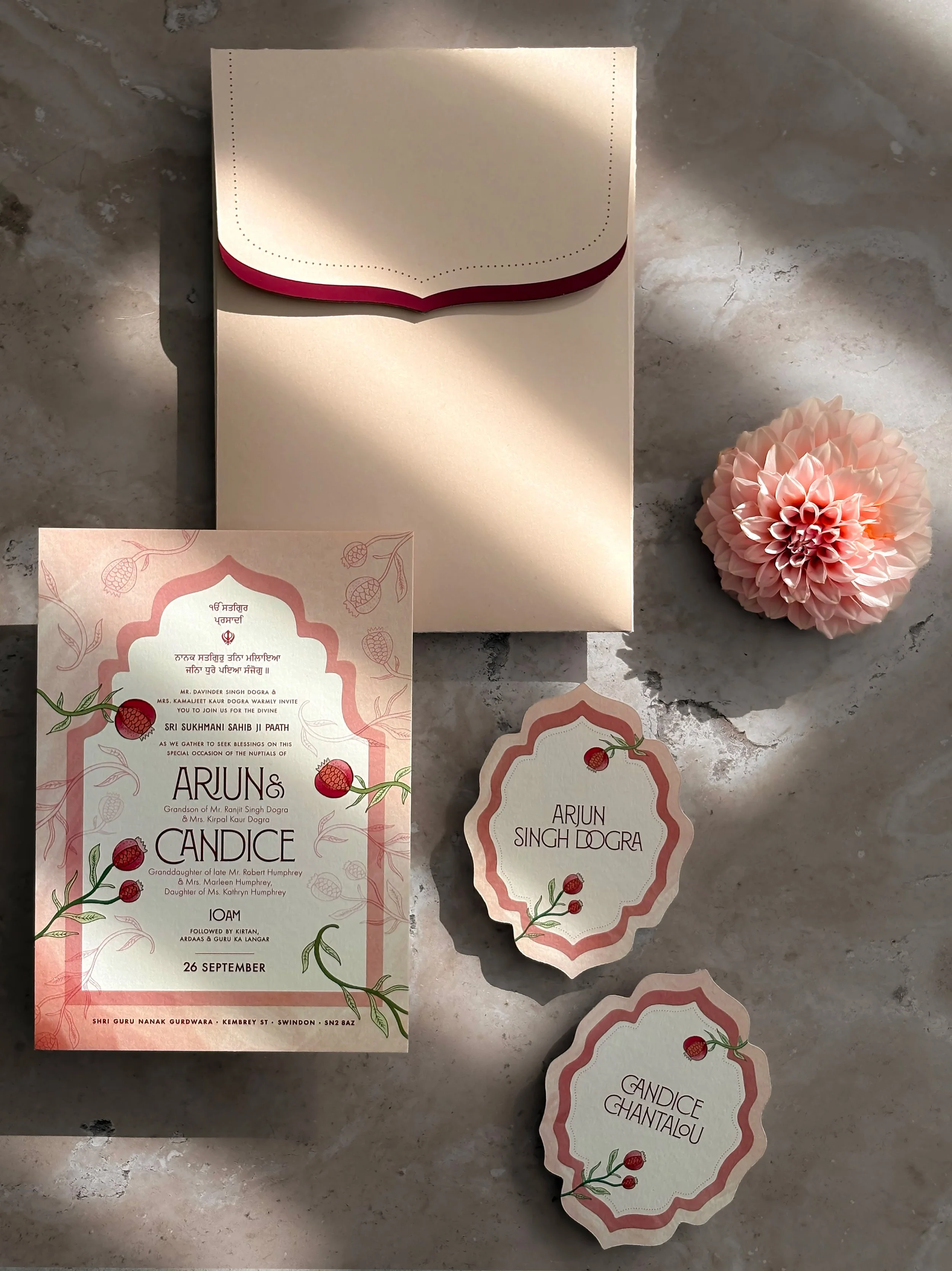 Botanical wedding invitations featuring pomegranates, vines and floral illustration.