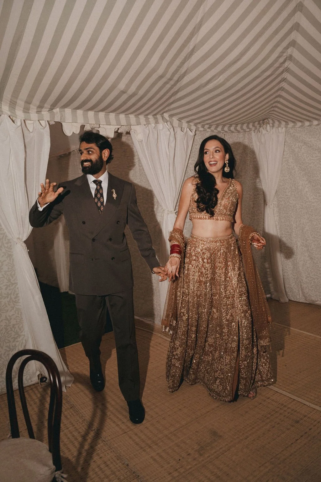 Bride and groom in traditional wedding attire at Kin House.