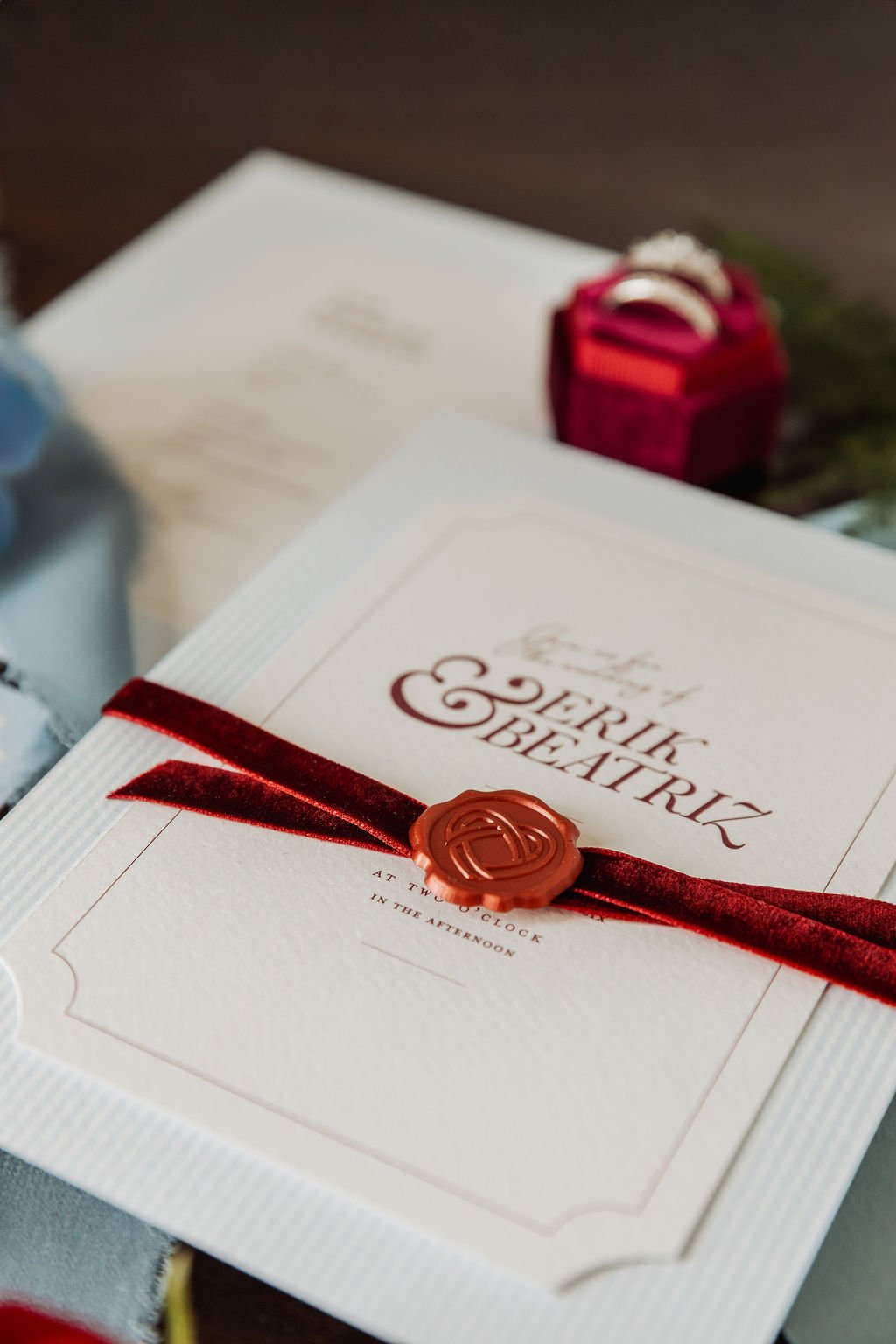 Luxury wedding invitation suite with vintages florals, powder blue and burgundy tones, handmade deckled paper, velvet ribbon and tassels. Designed by Carrie at Honey Bee Mine, and captured in the Scottish Highlands.