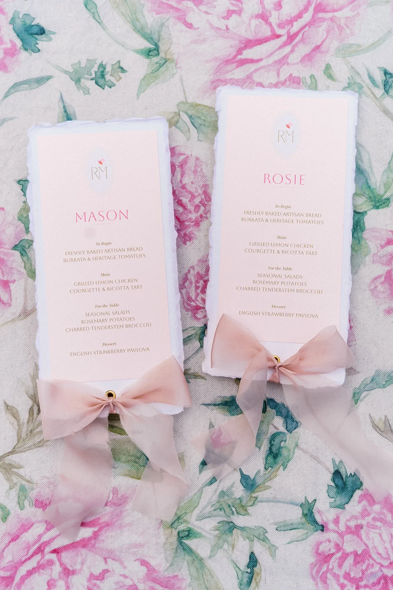 Romantic summer garden bespoke wedding menus designed by Carrie at Honey Bee Mine. Featuring deckled handmade paper, bespoke monogram, guest names, and blush tones. Finished with delicate silk chiffon ribbon. Captured at Styal Lodge.