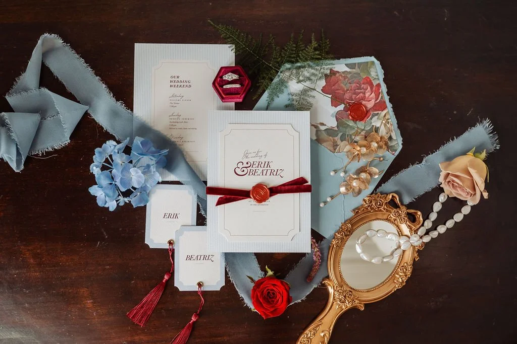 Luxury wedding invitation suite with vintages florals, powder blue and burgundy tones, handmade deckled paper, velvet ribbon and tassels. Designed by Carrie at Honey Bee Mine, and captured in the Scottish Highlands.