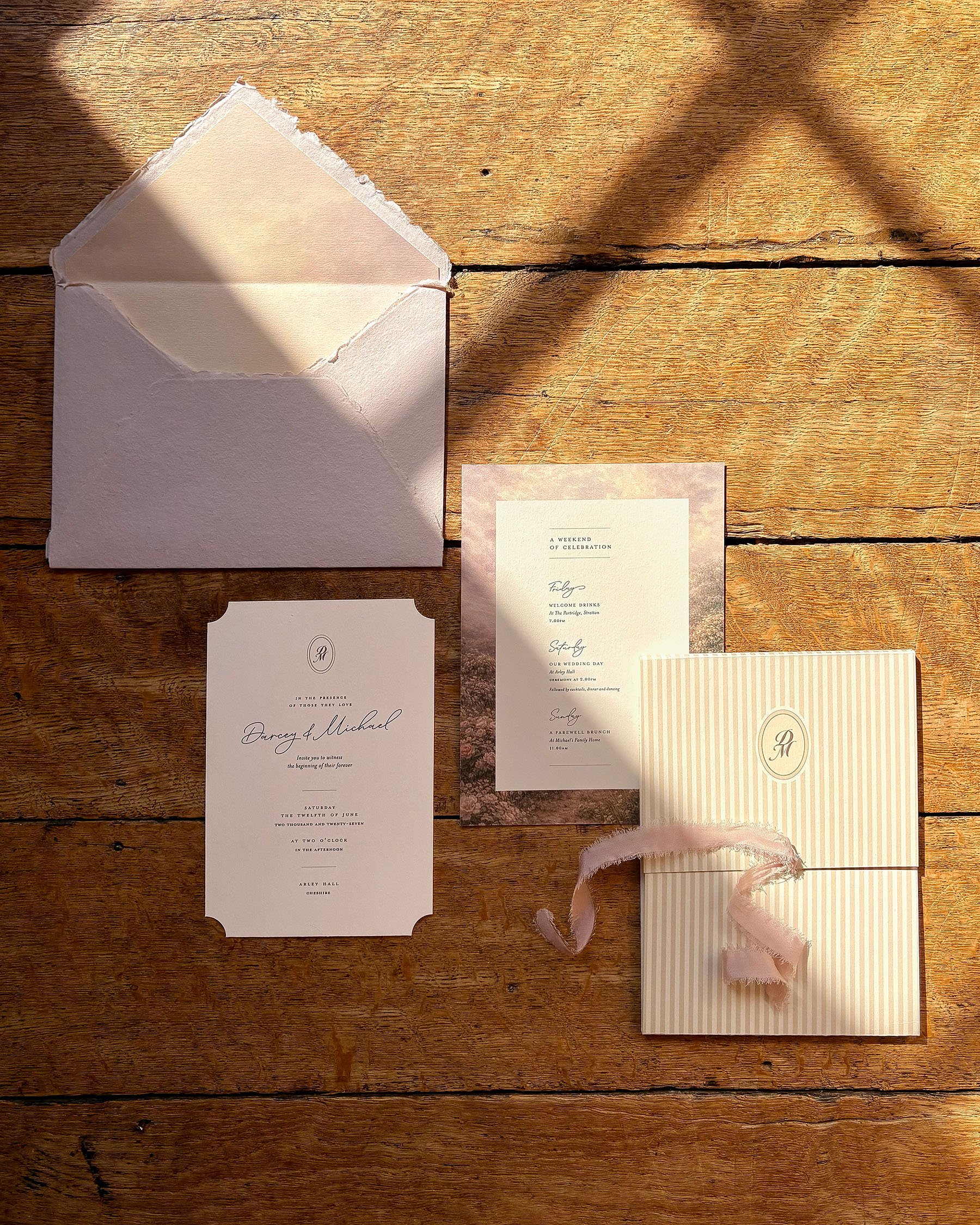 Luxury rose and ivory wedding stationery at Arley Hall & Gardens, featuring die-cut invitations, striped details and vintage rose ribbon by Honey Bee Mine.