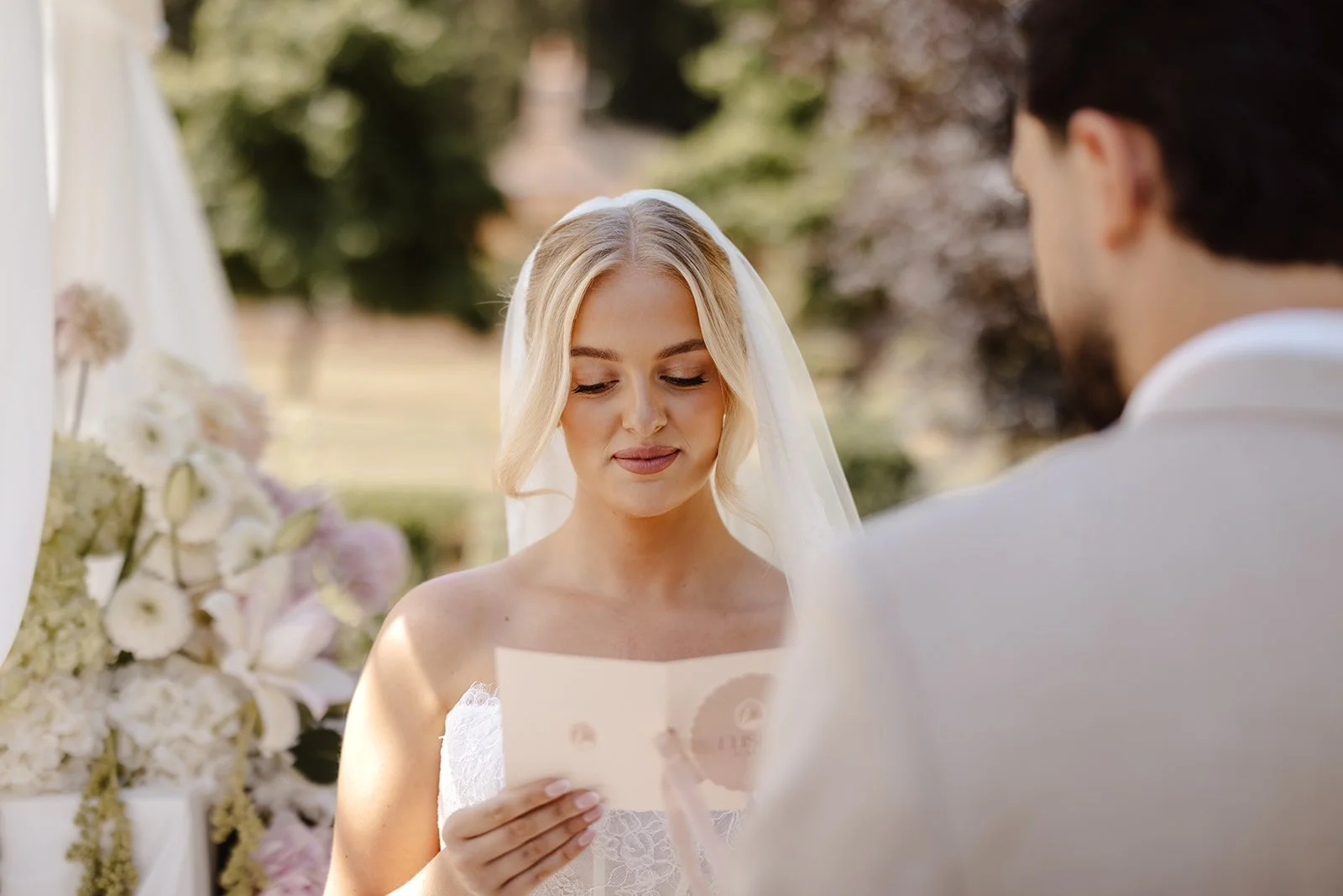 Luxury bespoke wedding vow books, featuring bespoke swan monogram, soft blush tones, and pure silk ribbon. Designed by Carrie at Honey Bee Mine, and captured at Capesthorne Hall.